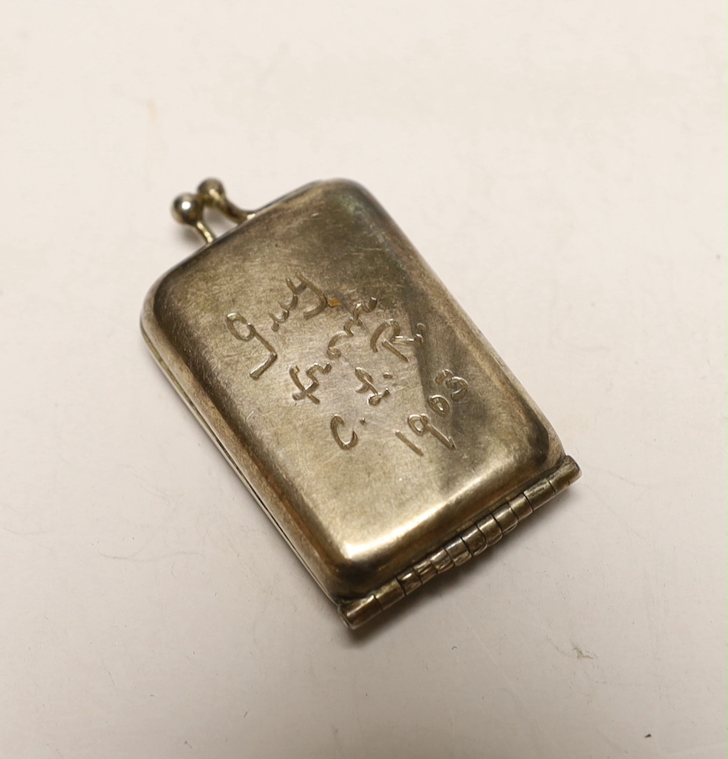 An Edwardian silver butt marker case, containing eight markers numbered 1-8, Albert Barker, London, 1902, with engraved inscription, 50mm.